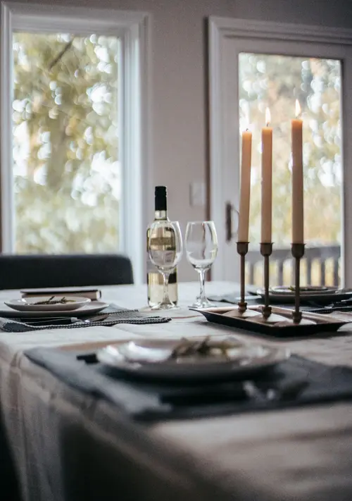 Table set for dinner with candles and wine