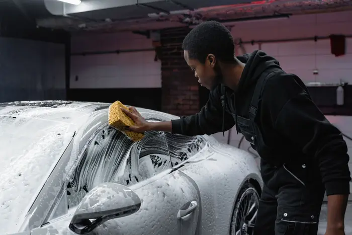 Apex Mobile Detailing technician hand-washing a car