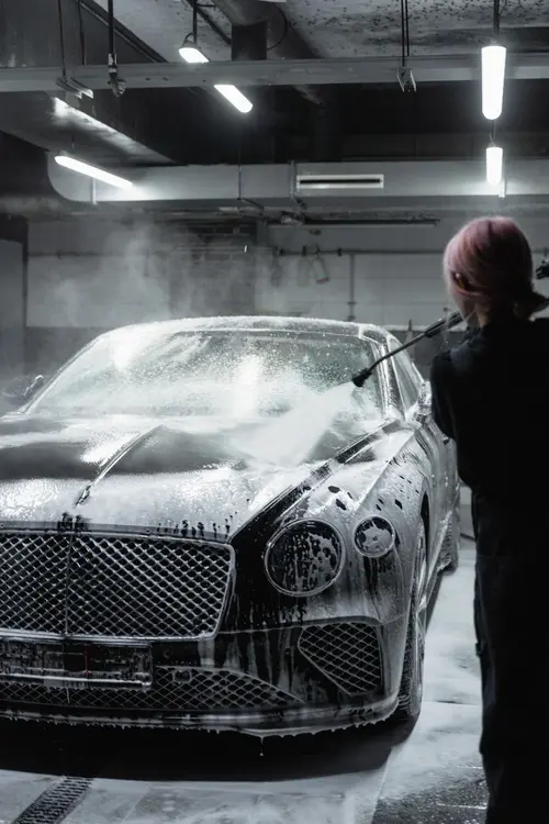 Foam cannon pre-wash on a luxury car